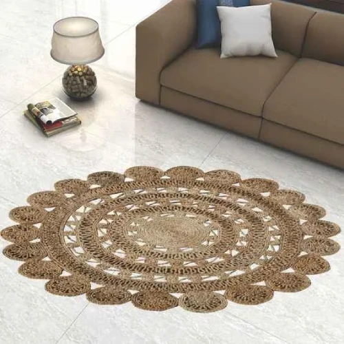 A circular jute rug with a detailed, floral pattern