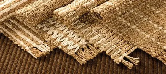 A collection of jute rugs with varying patterns and textures