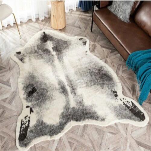 A large, faux animal skin rug with a grey and white pattern