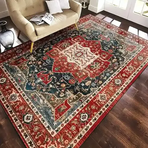 A large, rectangular Persian rug with a detailed, intricate pattern in shades of red, blue, and cream