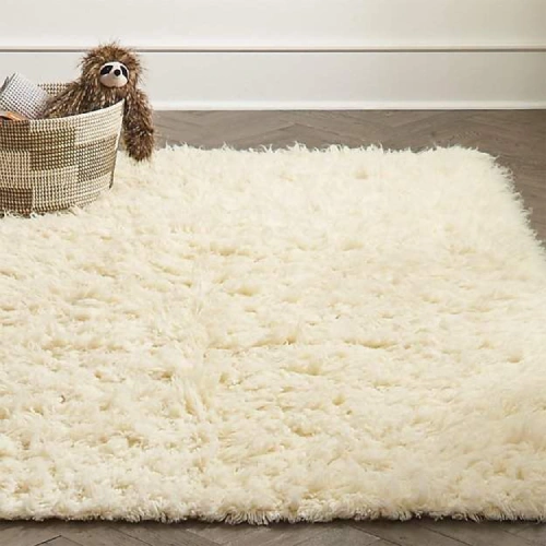 A luxurious cream-colored wool rug, perfect for adding warmth and texture to any room in your Dubai home