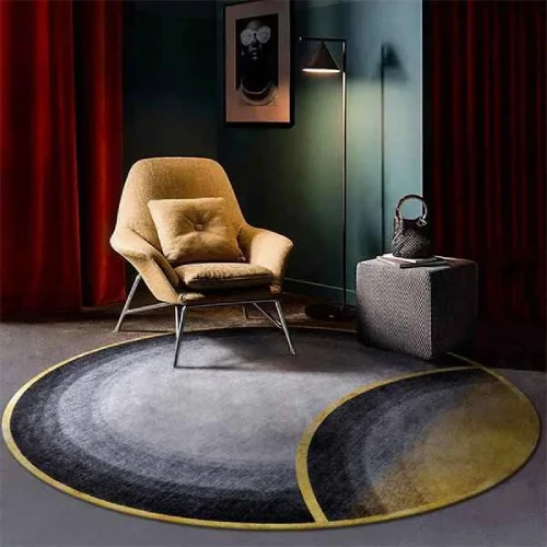 A round rug with a gray, black, and gold color scheme, featuring a unique half-moon design