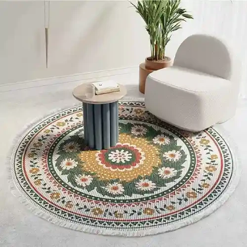 A round rug with a vibrant floral pattern in shades of green, yellow, and red, placed in a cozy living room