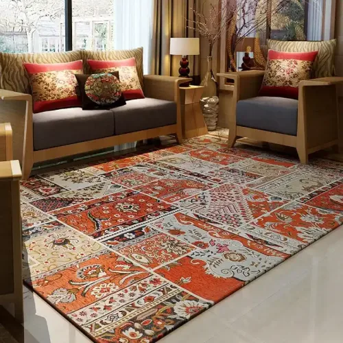 A vibrant patchwork rug in warm tones, featuring intricate patterns and designs