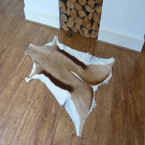 Animal skin rugs Dubai on wooden floor