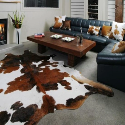 Beautiful animal skin rugs sitting with two sofa and table