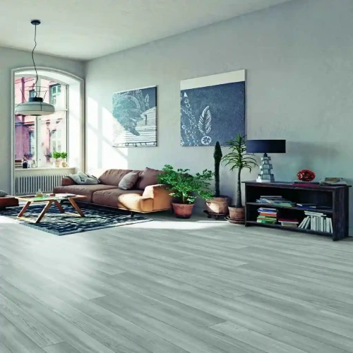 Modern living room with gray vinyl flooring. A brown leather sofa, a coffee table