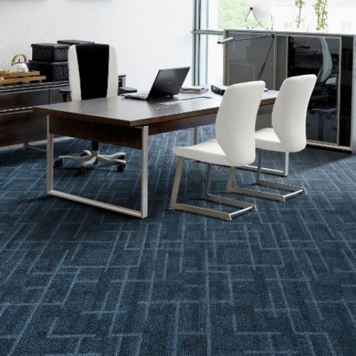 A modern office carpet with a dark blue featuring a geometric pattern