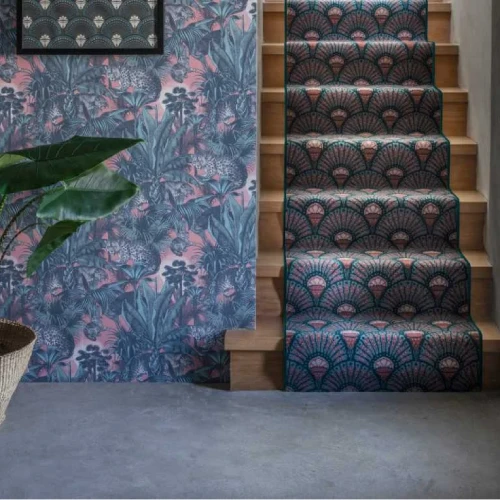 A patterned stair carpet in shades of pink, green, and blue