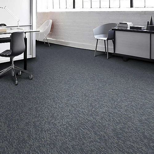 grey office carpet flooring, a long conference table, and rows of chairs