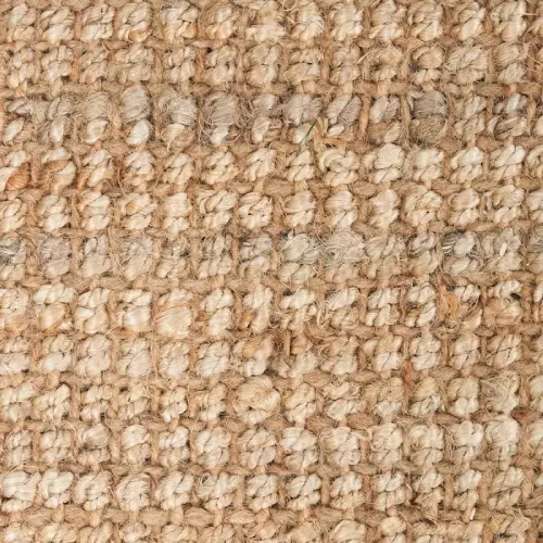 A close-up view of a jute rug's woven surface