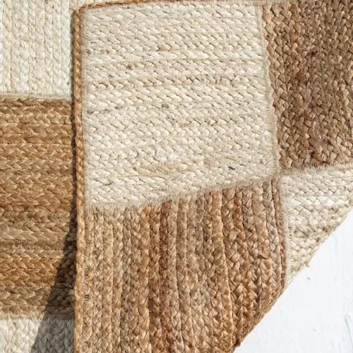 Close-up of a jute rug's textured, geometric design