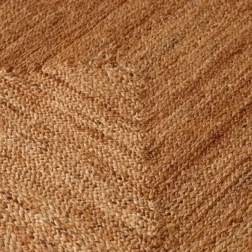 Jute rug texture highlighting the natural fibers and intricate weave